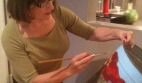 Judy Guglielmo preparing her sap bucket art for The Depot Theatre